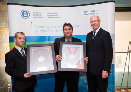 Photo of Columbia Power’s Chief Operating Officer, Frank Wszelaki and Health and Safety Manager, Andre Noel (L) are pictured alongside Jim Burpee (R), President and Chief Executive Officer of the Canadian Electricity Association (CEA) in Ottawa, Ontario proudly accepting Columbia Power’s 2012 CEA President’s Award of Excellence for Employee Safety, Silver Award Level and the CEA Vice President’s Award of Safety Excellence, Bronze Level for Generation.