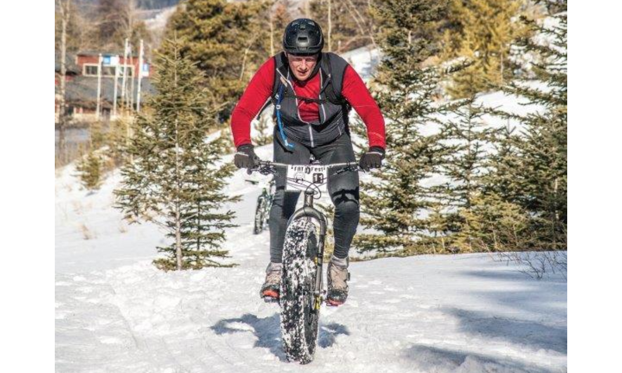 A mountain biker rides over snowy trails in Sparwood, B.C.