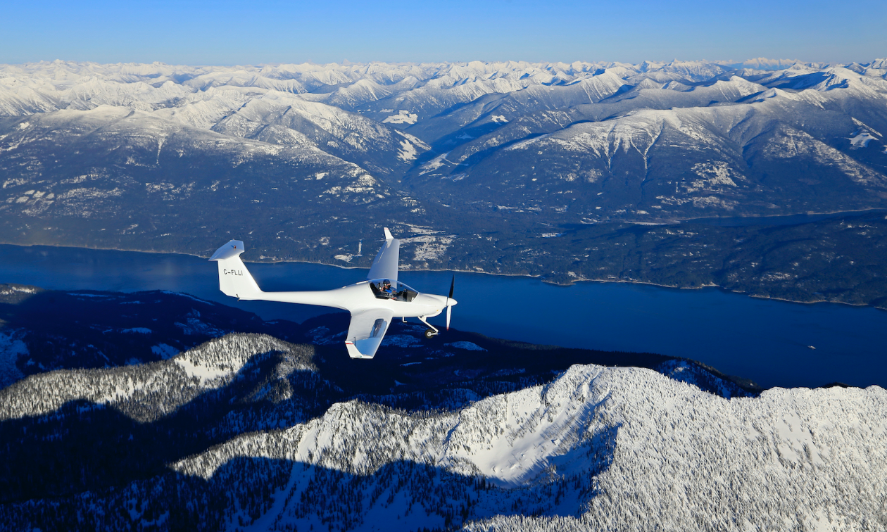 A Diamond HK36 self-launch glider soars over the Kootenays.