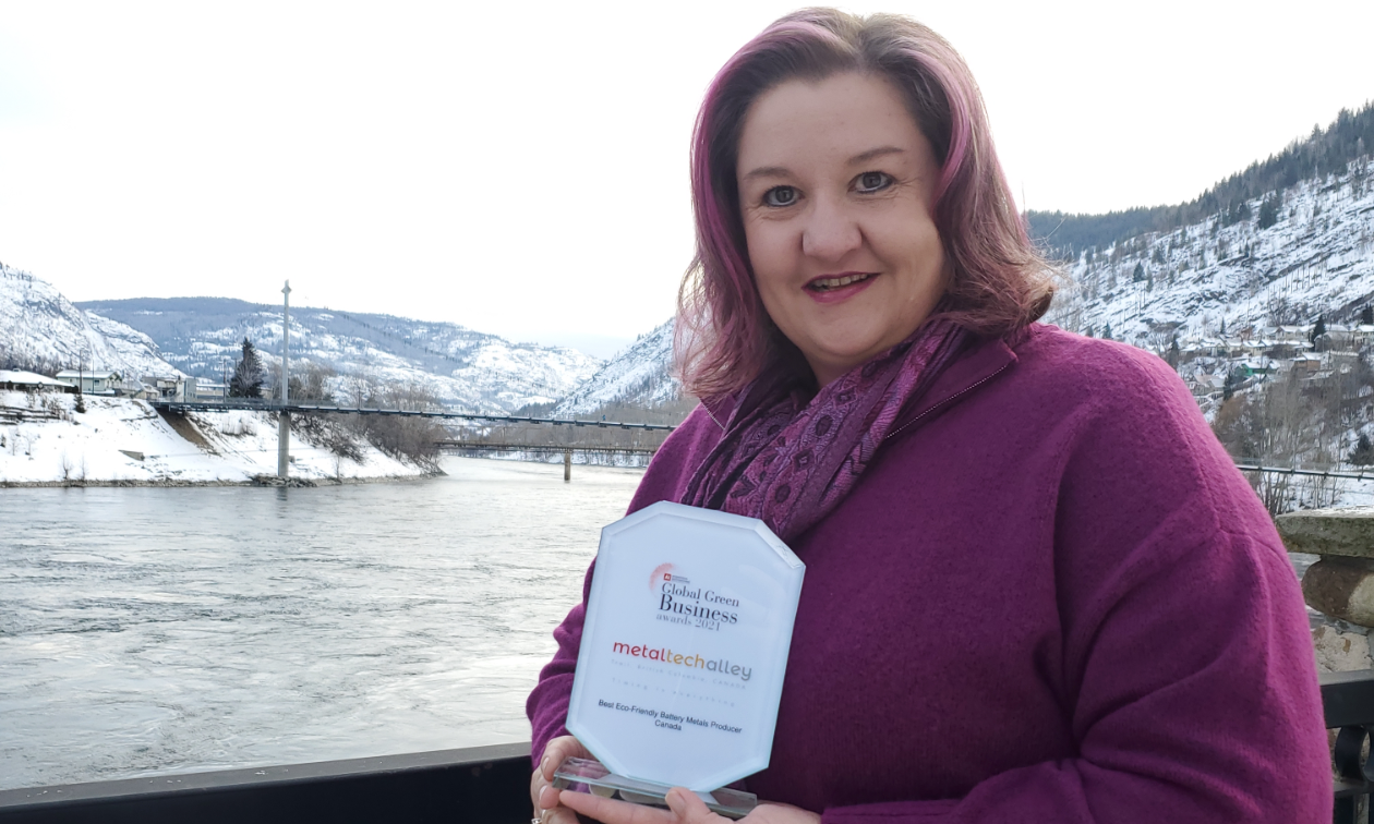 Jacomien van Tonder, the director for Metal Tech Alley, was recently presented with the Global Green Business Award’s Best Eco-Friendly Battery Metal Producer. She wears a purple shirt and stands on a bridge over frozen water in Trail. B.C.