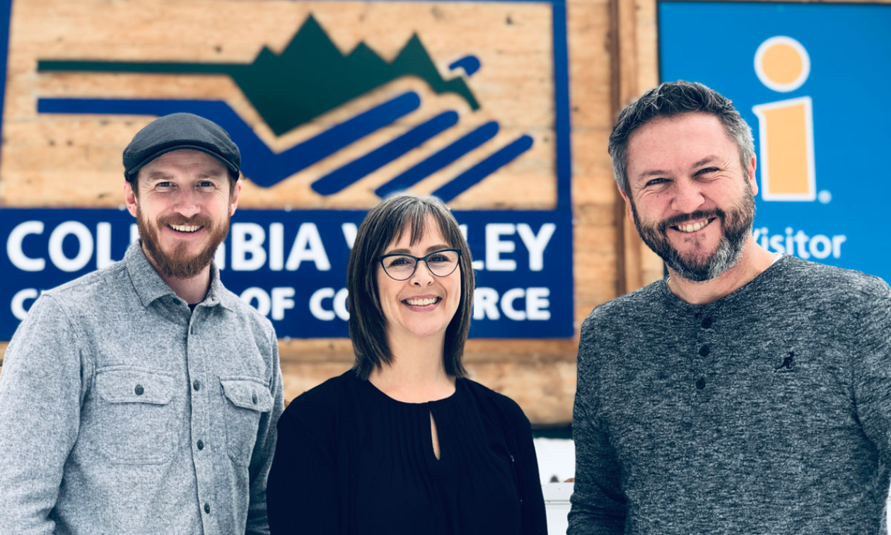 (L to R) Patrick Carrick, Toni Coward and Pete Bourke in front of the Columbia Valley Chamber of Commerce sign. 