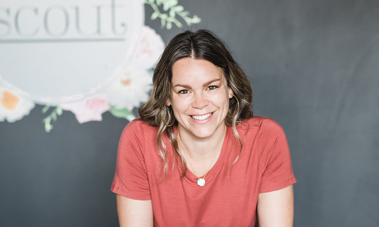 Laura Price smiles wearing a pink shirt. 