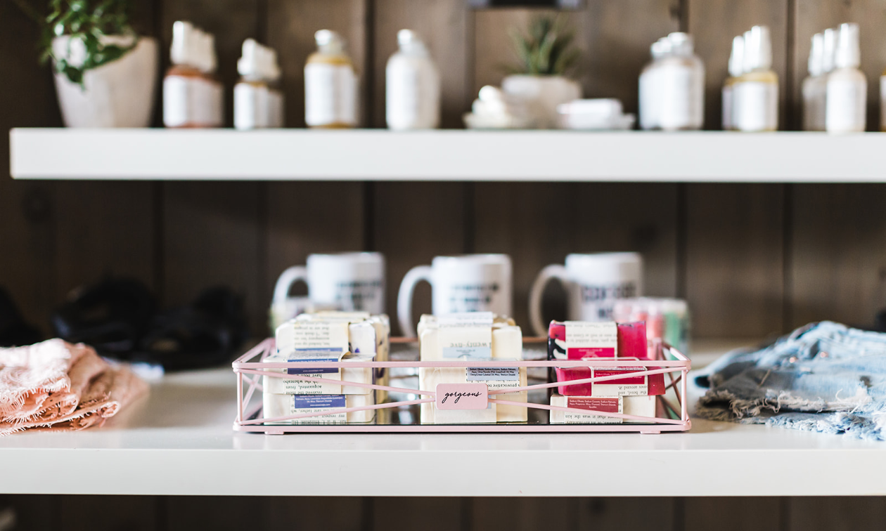 Soaps and lotions are on display on a counter.