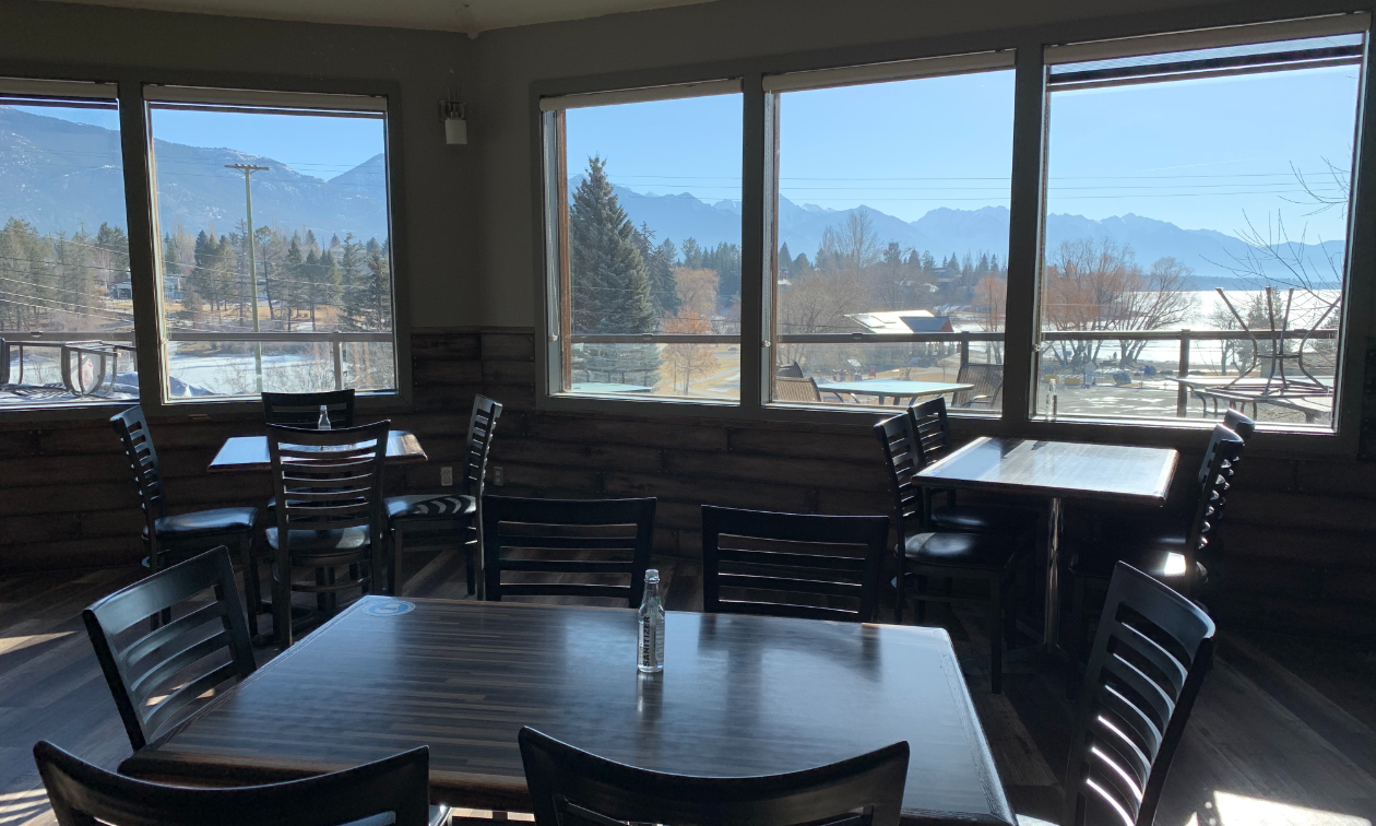 The view of Kinsmen Beach and Lake Windermere from inside The Station Pub. 