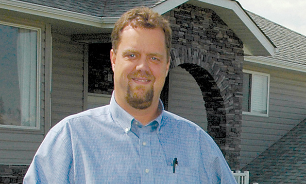 Picture of Jason Wheeldon standing in front of a house. 