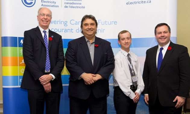 Jim Burpee, President and CEO of the Canadian Electricity Association (left) and Employment Minister, the Honourable Jason Kenney (right) flank Columbia Power representatives, President and CEO Frank Wszelaki (centre left) and Health and Safety Manager, Andre Noel (centre right)