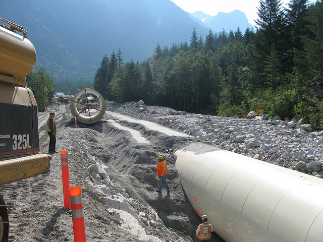 Backfilling a large diameter pipe for a hydroelectric project 