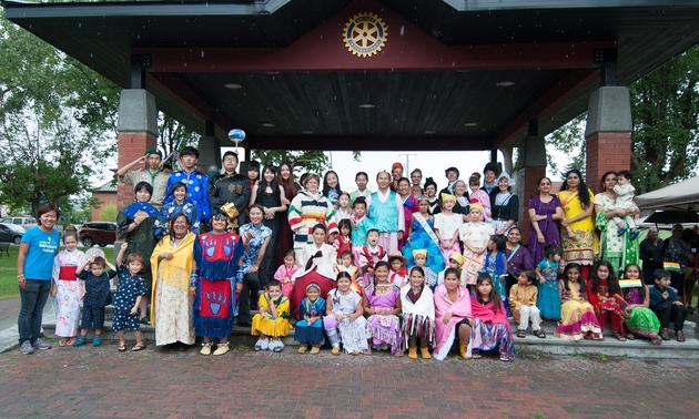 people gathered wearing traditional clothing from various cultures