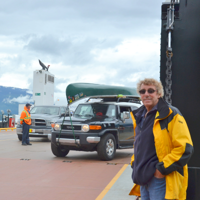 John Harding stands on one of his ferries