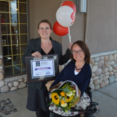 (L to R) Amie Lubbers, sales co-ordinator for Kootenay Business magazine, presents one of three Influential Women In Business awards to Grace Brulotte, president and program manager for FIRE: Fernie Adaptive Snow Program. 