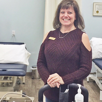 Suzanne Thompson stands in Kootenay Therapy Center.