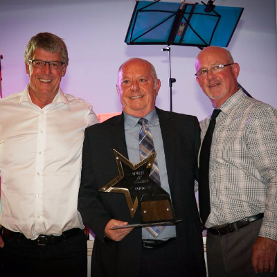 Well-known business owner, Dan Ashman (pictured centre), is dealer principal of AM Ford and was recently awarded Trail's Business Person of the Year Award.