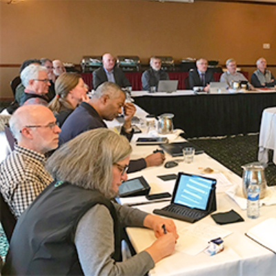 Representatives from the seven credit unions attending a December meeting to learn more about the amalgamation currently being explored.