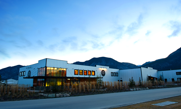 A picture of Kicking Horse Coffee headquarters with a mountainous background.