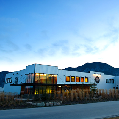 A picture of Kicking Horse Coffee headquarters with a mountainous background.