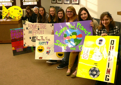 Students from Fernie Secondary School display their Paint the Town for Fish posters at Fernie City Council.