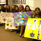 Students from Fernie Secondary School display their Paint the Town for Fish posters at Fernie City Council.