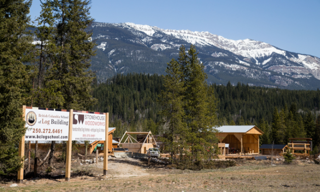 The BC School of Log Building and Stonehouse Woodworks in the midst of mountains in Golden, B.C.