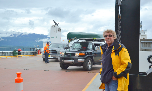 John Harding stands on one of his ferries