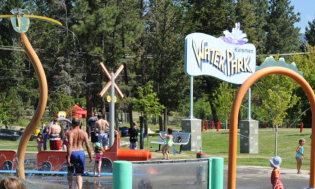 Kids play in a spray park.