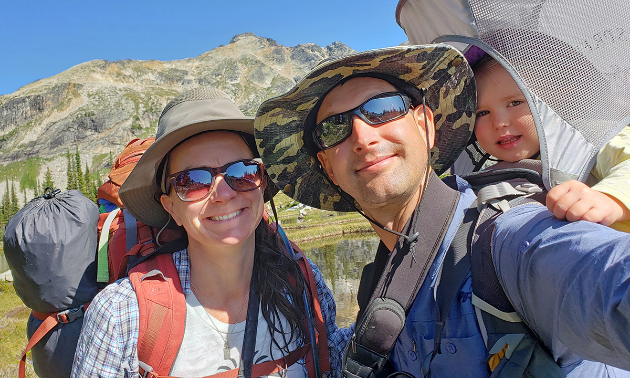 Lucas Jmieff with Ginia Jmieff in the mountains with their four-year-old daughter.