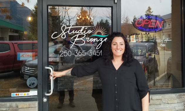 Nikki Luxton, owner of Studio Bronze, standing in front of her store. 