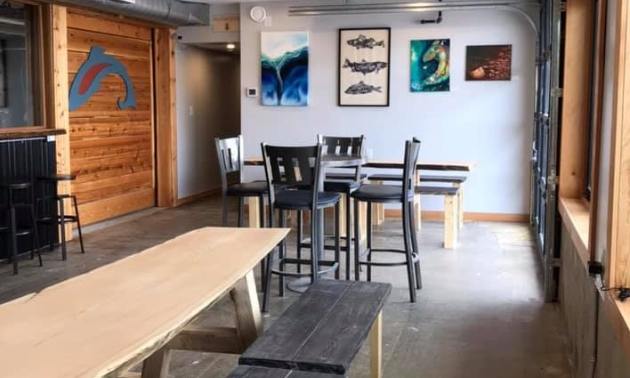 The interior of Tailout Brewing has pictures and images of fish on the walls. 