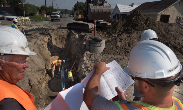 Workers plan what to do on 2nd Street South