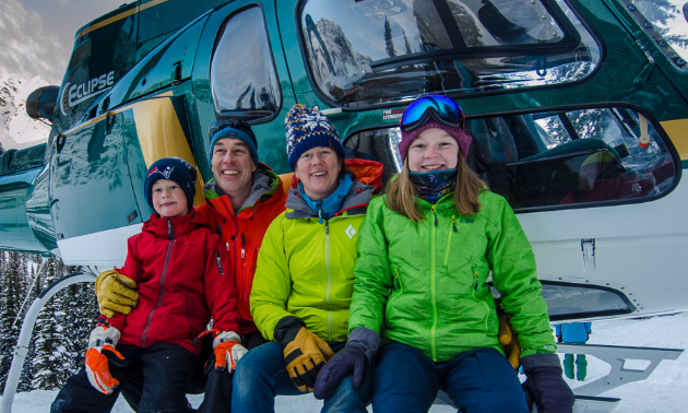 (L to R) Alden, Mark, Sarah and Grace Yancey sit on a helicopter