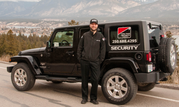 David Read stands next to a Jeep