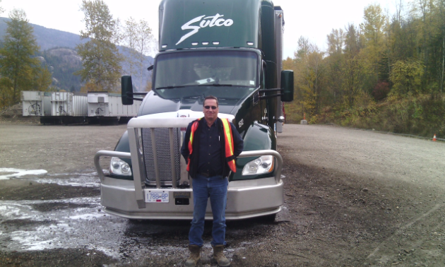 Jim Hymer stands in front of his truck