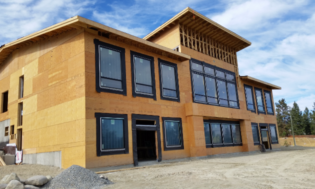 A wooden structure is under construction