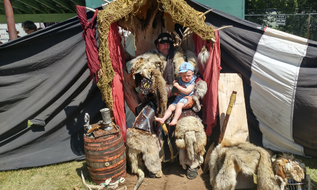 My son, Augustus, isn’t quite sure what to think about being held by an intimidating Viking as he sits on his impressive throne.