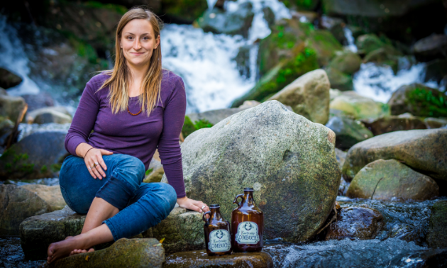 Lavinia Lidstone sits near a waterfall