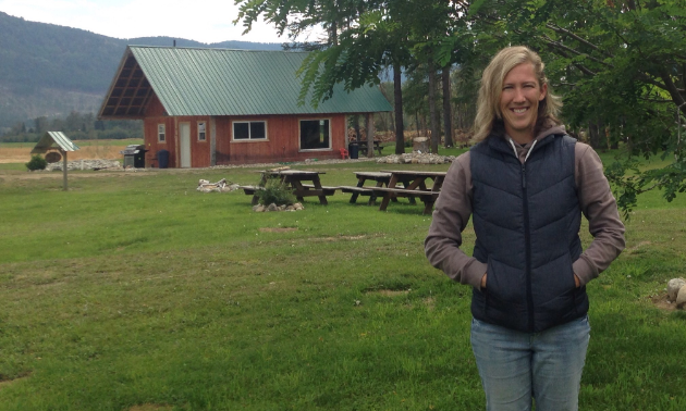 Rebekah Tebrinke stands in front of her business, PV Ranch Getaway, north of Grand Forks.