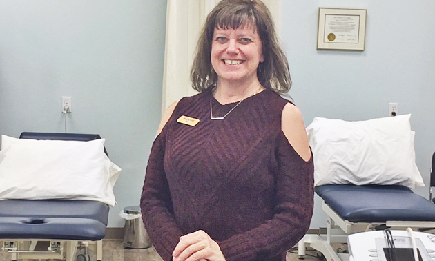 Suzanne Thompson stands in Kootenay Therapy Center.