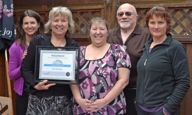Ulli Mueller holds her 2016 Volunteer of the Year certificate with Community Futures staff members Andrea Wilkey, Val Radcliffe and Don McCulloch, and Board Director Frances Swan