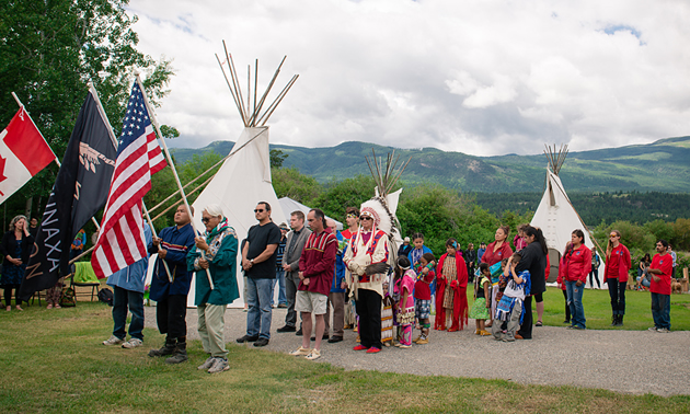 First Nations people in colourful traditional dress, at National Aboriginal Day parade