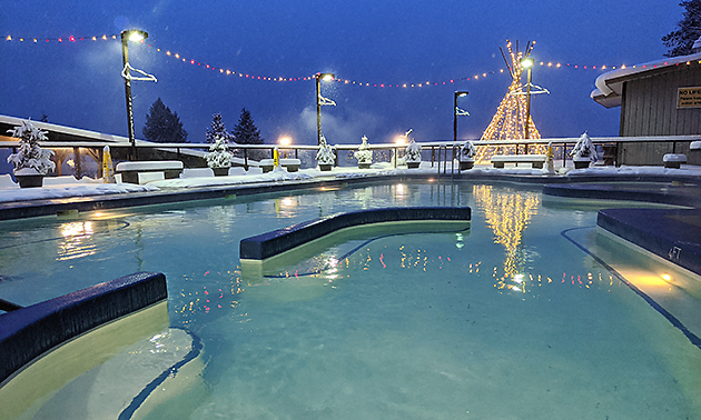 Ainsworth Hot Springs pool on a snowy winter night. 