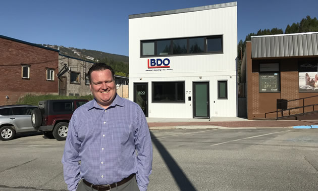 Alan Rice stands outside the new BDO office in Kimberley