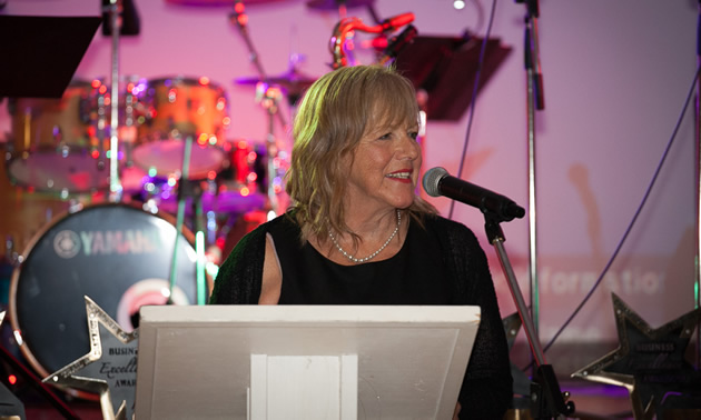 Audry Durham, executive director of the Trail & District Chamber of Commerce, speaks from the podium at the 2017 Business Excellence Awards gala.