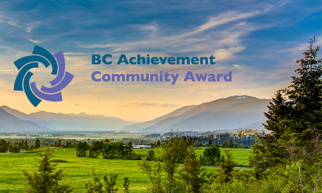 Scenic picture of Creston valley, with logo of BC Achievement Foundation Community Awards. 