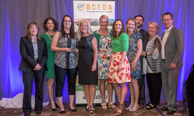 Imagine Kootenay staff and partners proudly display their Marketing Innovation Award at the BC Economic Development Association Summit in Vancouver.