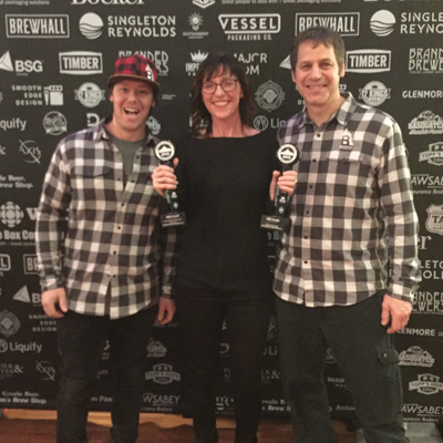 From left, Brent Malysh, Tracey Brown, and Mike Kelly are the owners of Backroads Brewing Company in Nelson.