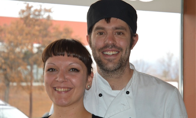 Chris Earle and Crystal Dillabough in front of the window at the newly opened Baker Street Cafe.