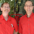 Two middle-aged men in red summer Home Hardware shirts