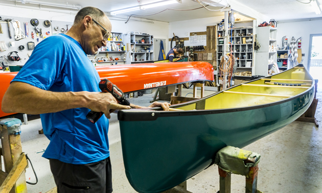 Bob Hellman works on a Hellman canoe