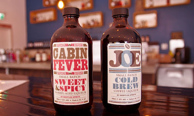 Bottles of Cabin Fever sipping whiskey and JOE coffee liqueur.  