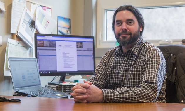 Brad Parsell, executive director of the Fernie Chamber of Commerce, at his desk