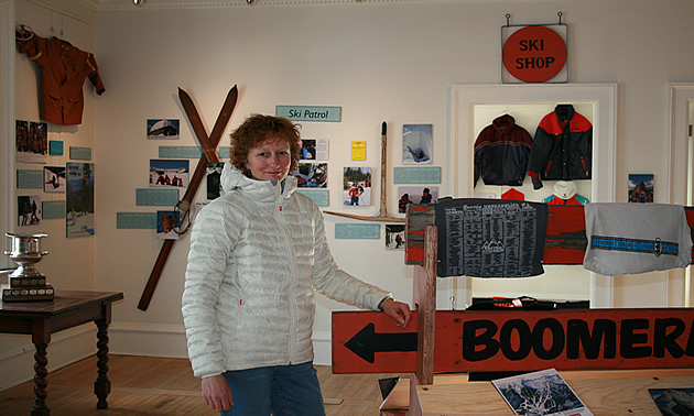 Lori Bradish standing inside of the exhibition.